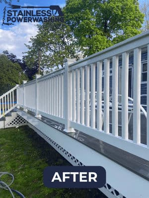 Clean white railing and deck after power washing, highlighting restored outdoor space.