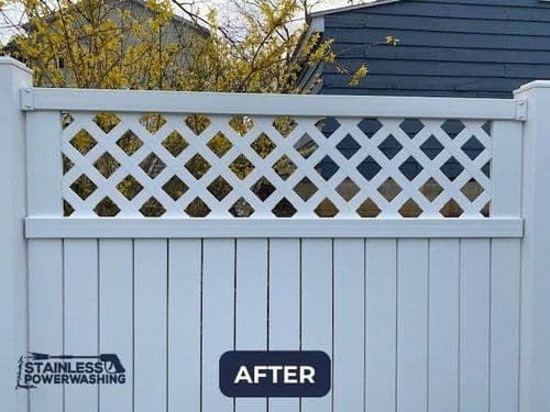 Clean white wooden fence with decorative lattice top, improved appearance after power washing.